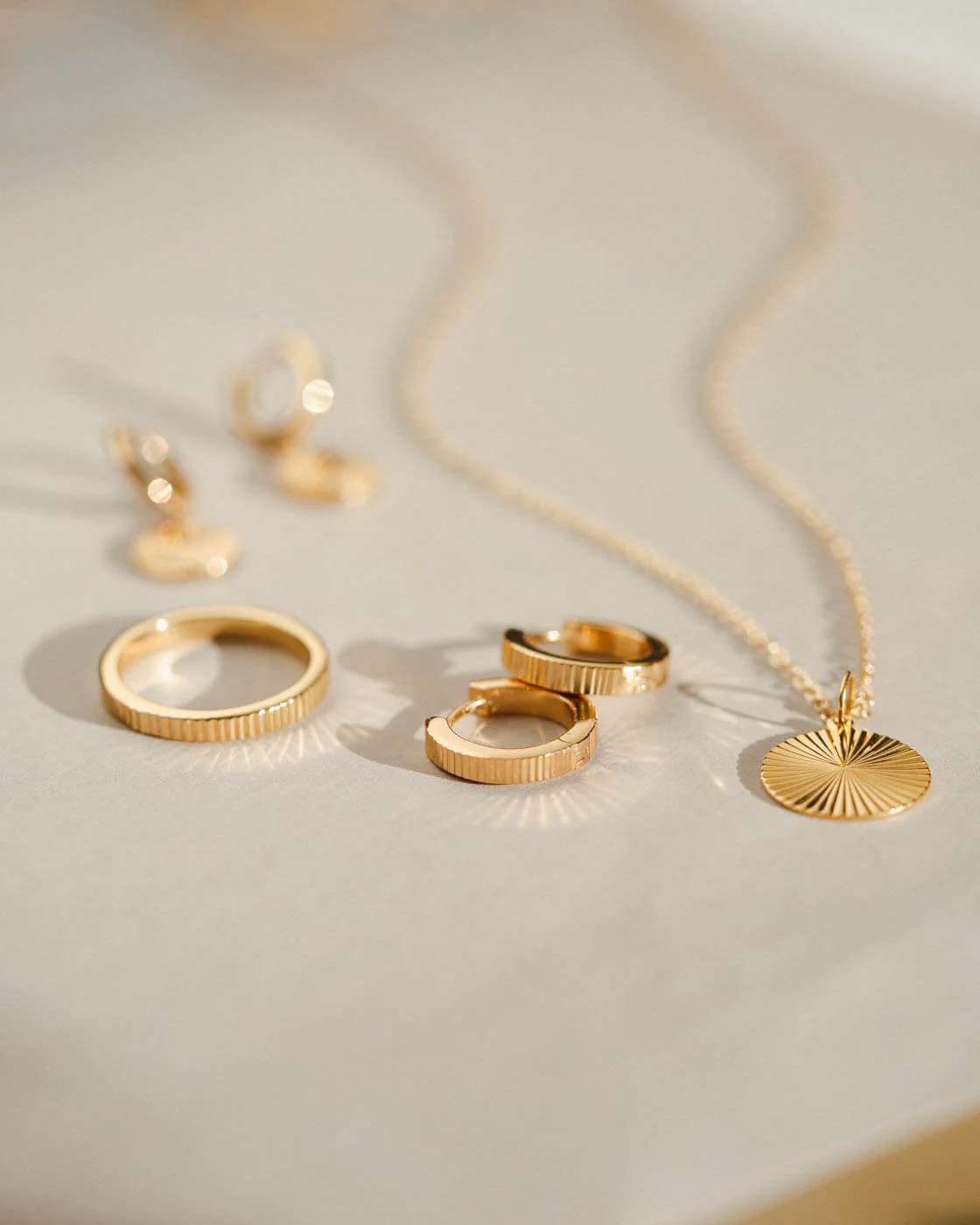 Radiant Charm Huggie Hoops - Image 8